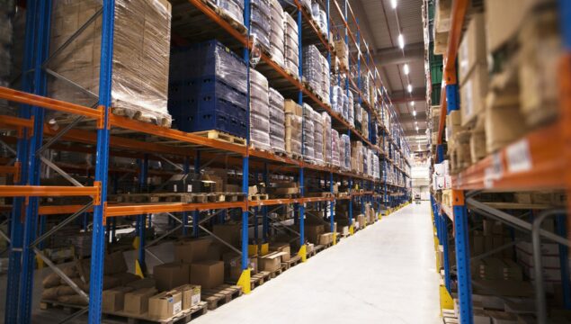 interior-large-distribution-warehouse-with-shelves-stacked-with-palettes-goods-ready-market